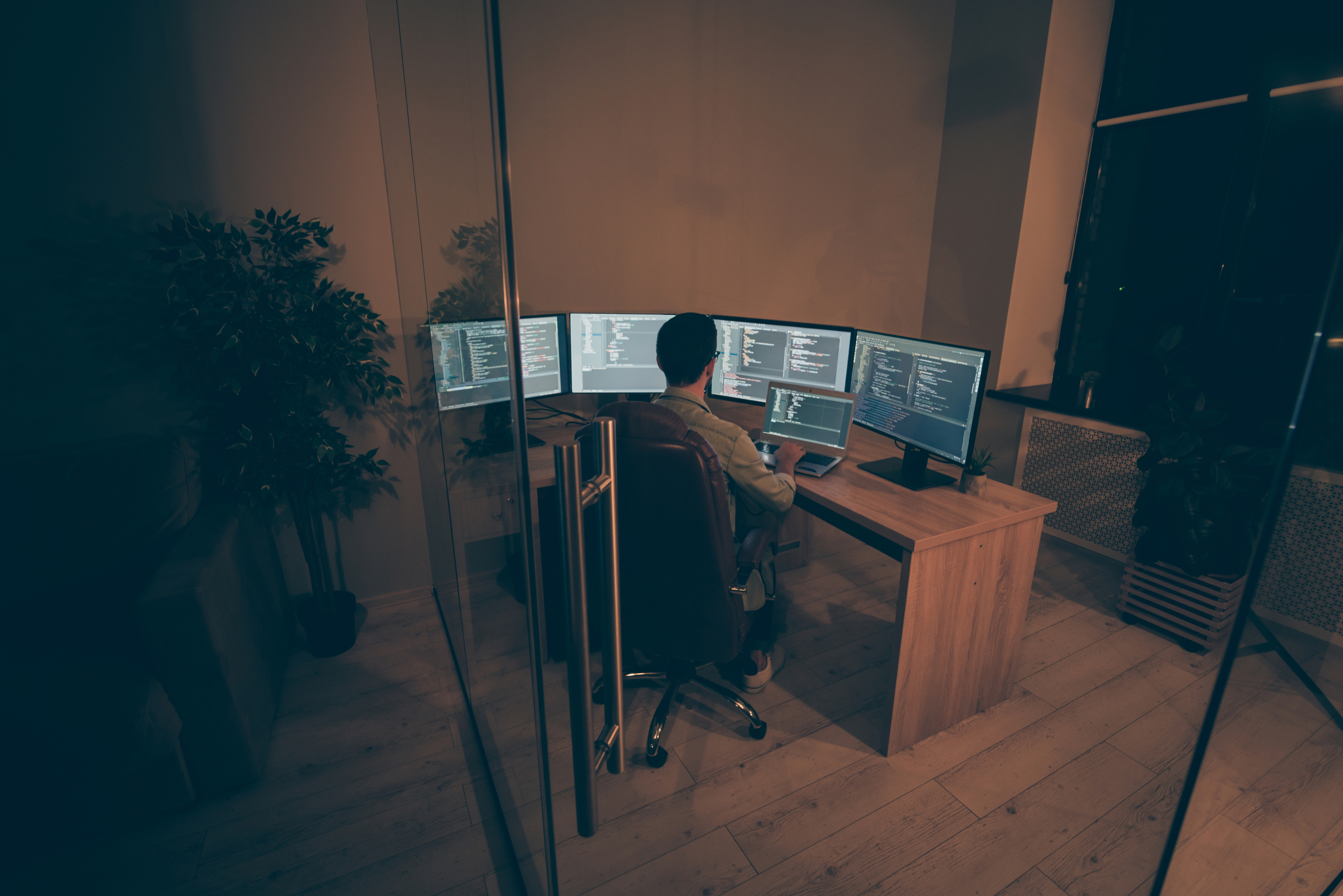 Top above high angle view photo of programmer ensuring normal work of server responsible for cyber security working with java script and C holding maintenance to reboot device